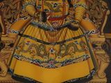 a painting of a woman sitting on a throne