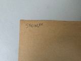 a brown piece of paper with writing on it