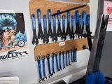 many wrens hanging on the wall in the garage