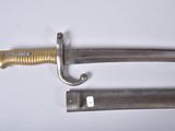 two knives are laying side by side on a white surface