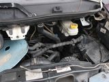 the engine of a car with its hood open and the hood down