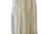 an image of a white dress on a mannequin stand