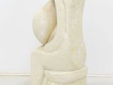a sculpture of a woman holding a baby in her arms