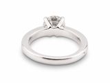 an engagement ring with a single diamond in the center