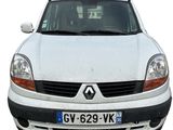 a white van that is parked in front of a building