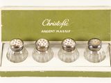 three salt and pepper shakers in a box on a white surface
