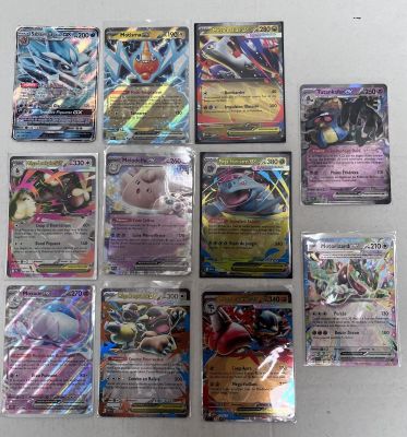the pokemon cards are lined up on the table ready to be played