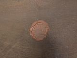 a red object on the floor next to a black object