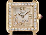un gros plan d'une montre en or dont le cadran est orné de diamants