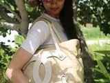 a woman that is holding a bag in her hand