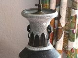a lamp that is on top of a wooden table
