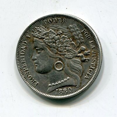 une vieille pièce d'argent avec un visage de femme dessus
