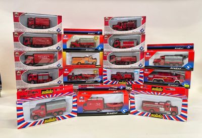 a lot of toy fire trucks that are in the box