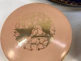 a plate with a picture of a horse on it next to another plate