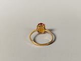 an image of a gold ring with a citrine stone on it