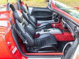 an image of a red sports car with its doors open