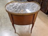 a small table with a marble top in a store