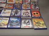 a lot of video games sitting on a table