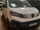 the white van is parked in a garage with other vehicles