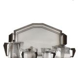 a silver plated tray with four cups and a tray with a mirror on it