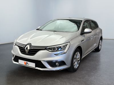 the front view of a silver car in a showroom