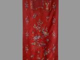 a red chinese wall hanging with a picture of birds and flowers