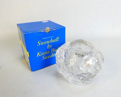 a crystal ball sitting next to a box of snowballs