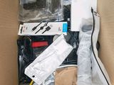 a cardboard box filled with electronics and other items