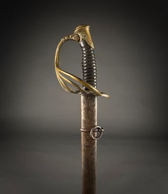 a close up of a sword with a gold handle on a black background