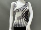 a mannequin wearing a black and white top and black pants