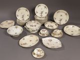 many different types of plates and bowls on the table