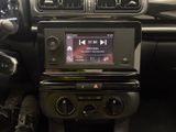 a radio in the center of a car that is connected to the dashboard