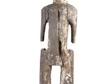 an image of a wooden statue of a man with a hat on his head