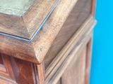 a wooden table with a mirror on top of it