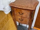 a small wooden table with a drawer on top of it