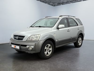 a picture of a silver suv parked in a garage