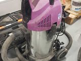 a vacuum that is sitting on a table in a room
