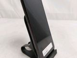 a cell phone that is sitting on a stand