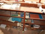 a desk with a lot of books and papers on it