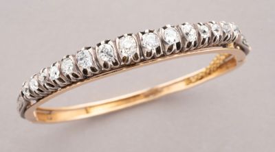 a close up of a diamond ring on a table