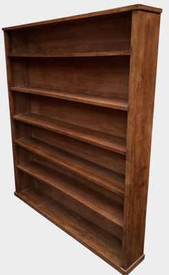a wooden bookcase with four shelves on each side