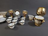 many different types of dishes and cups on the table