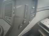 a dashboard of a car with a steering control panel