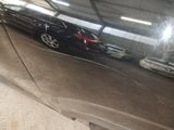 a reflection of a car in the side mirror of a car