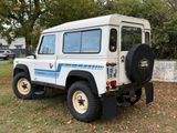 a picture of a white land rover parked in the grass