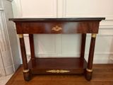 a small table with a drawer on top of it