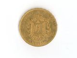 a gold coin with a coat of arms on it