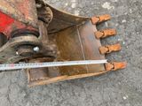 a measuring tape on the back of a bulldozer