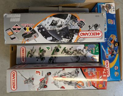 three boxes of legos sitting on the floor