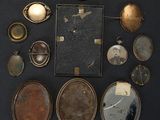 an image of a collection of antique lockes and pendants